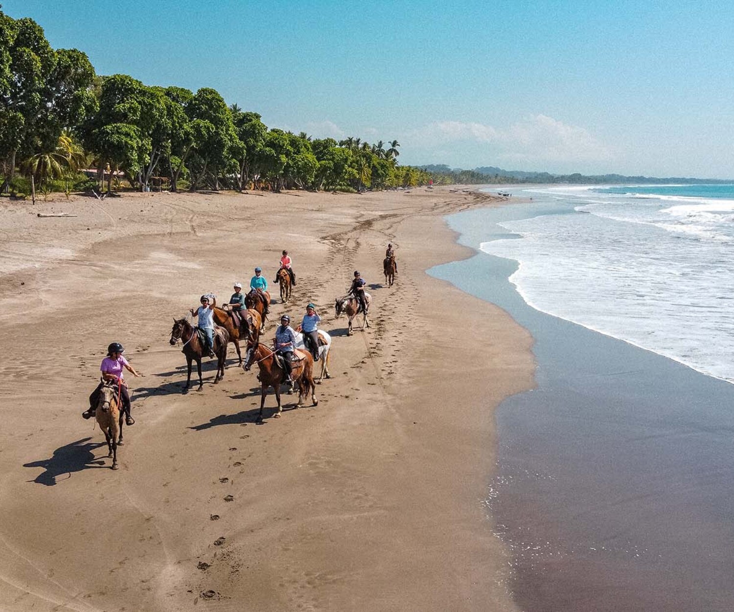 Ride horses on the beach in Costa Rica