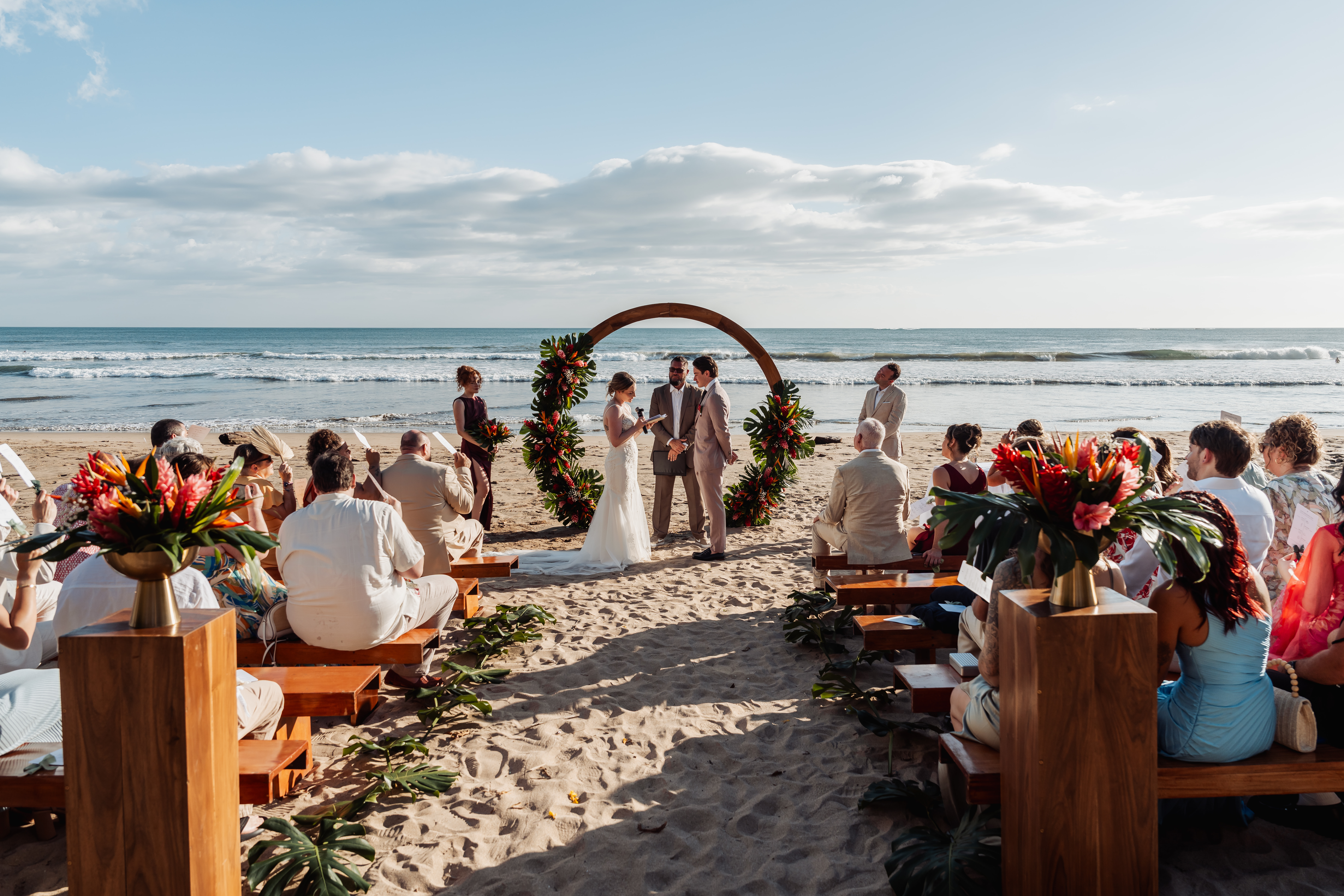 Oceanfront wedding ceremony with guests at ONDA Playa Grande